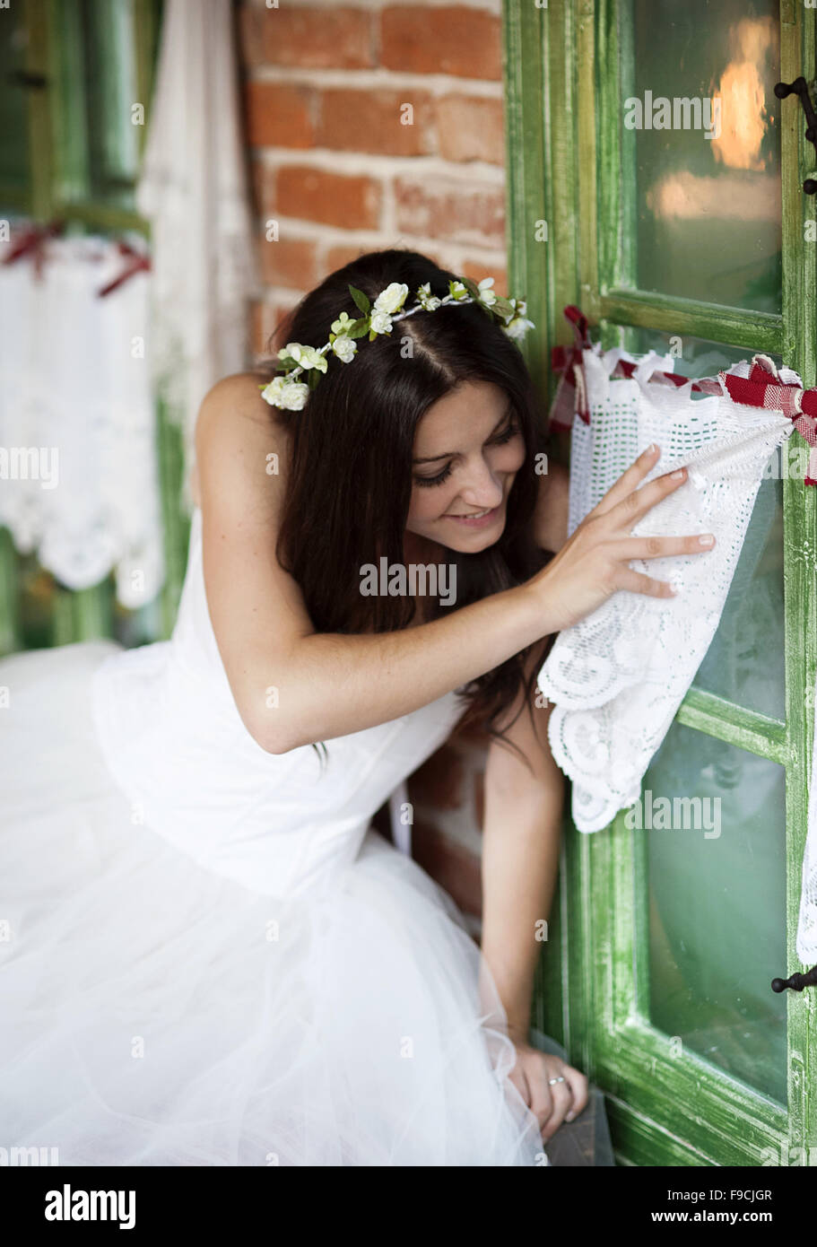 Beautiful Bride In Country Style Wedding Dress Is Looking Out Of