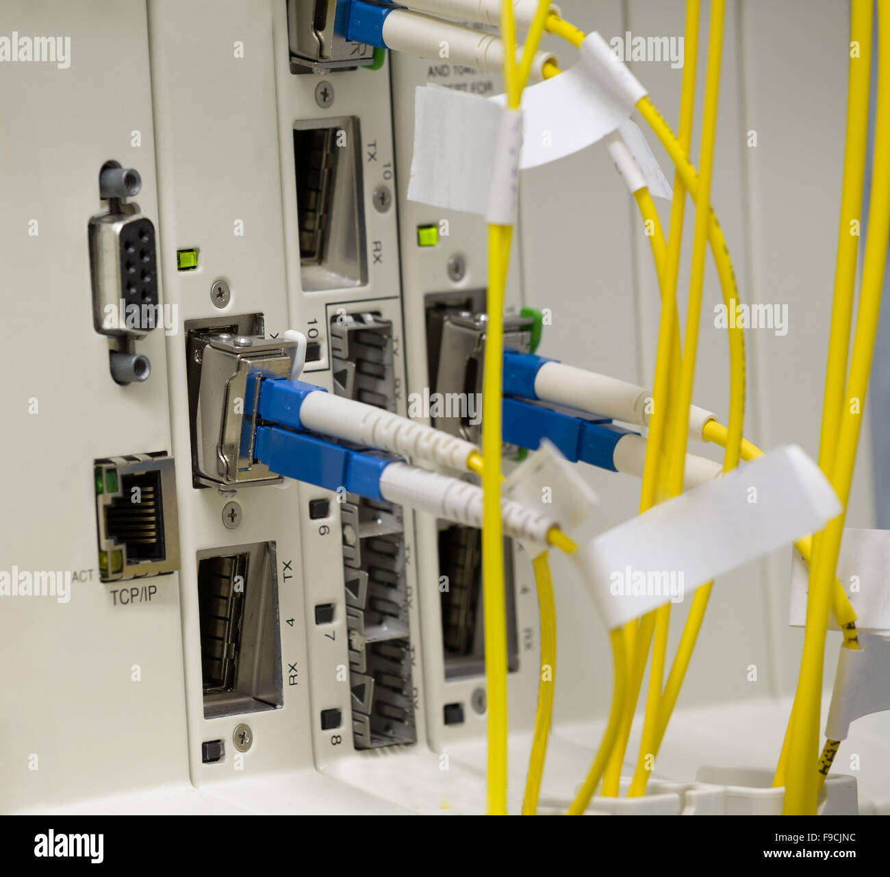service provider data center with media converters and optical cables Stock Photo