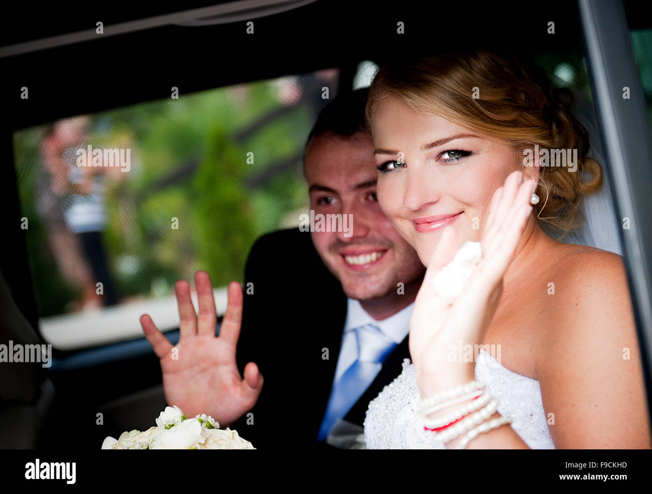 Bride and groom in the car at the wedding day Stock Photo - Alamy