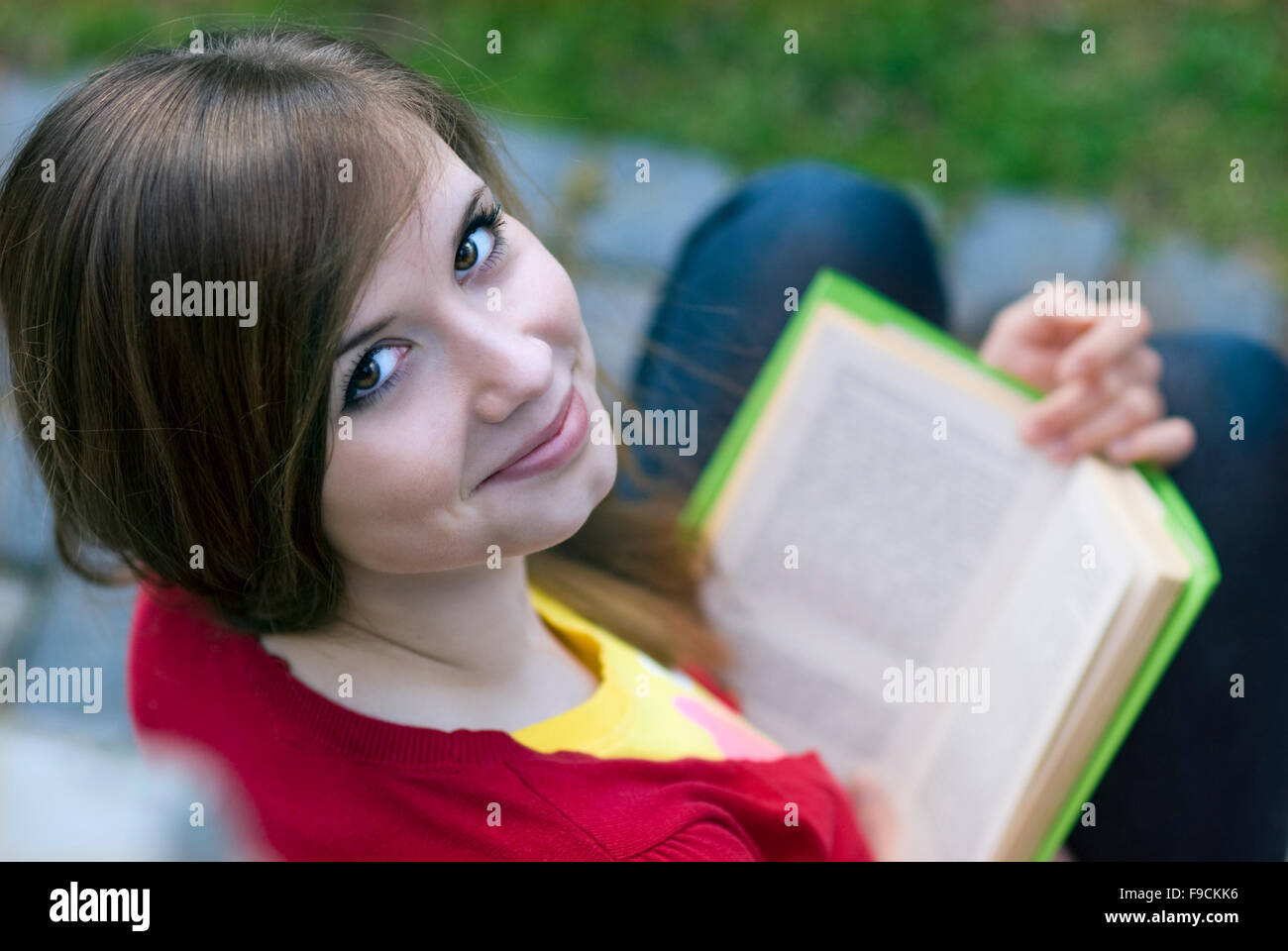 Beautiful girl is reading book. Stock Photo