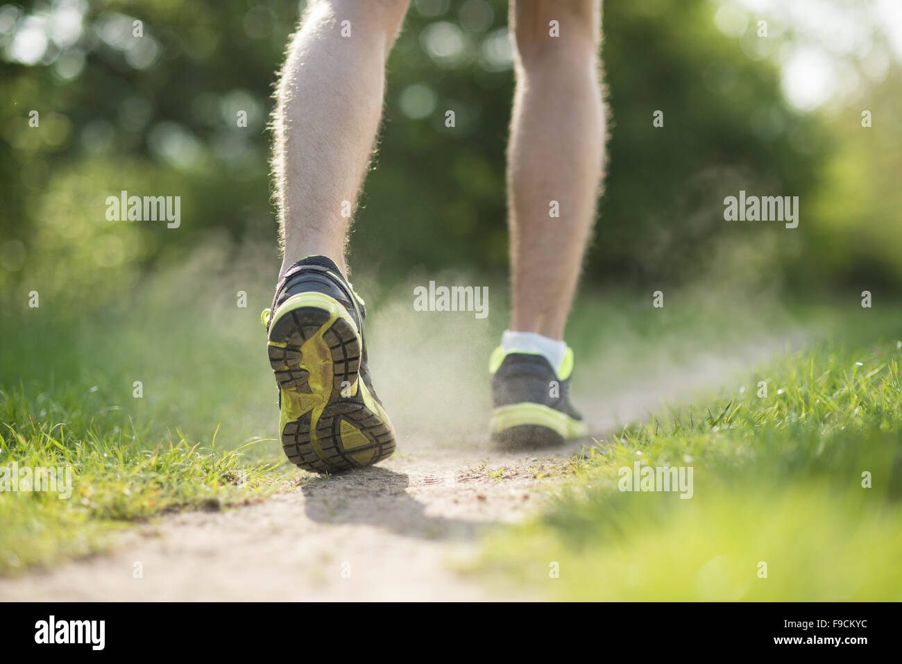 Man trail running dust hi-res stock photography and images - Alamy