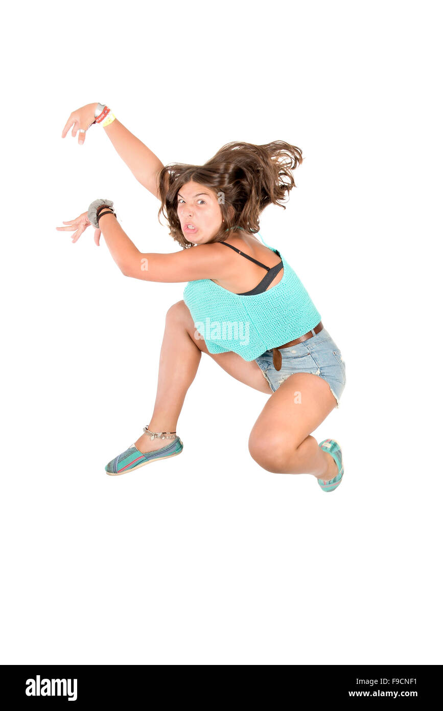 Young girl doing funny acrobatic jumps isolated in white Stock Photo