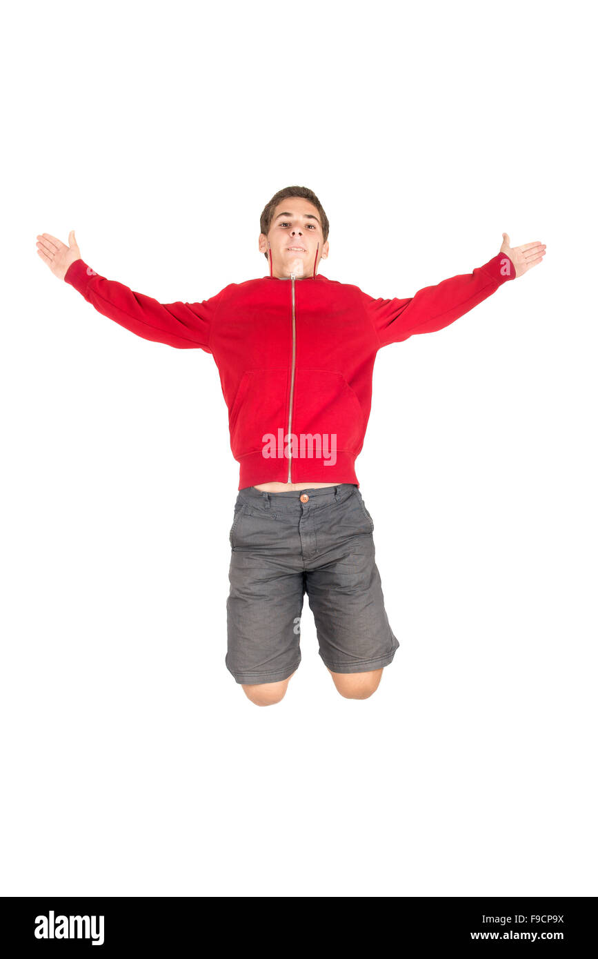 Teenage boy  doing funny acrobatic jumps isolated in white Stock Photo