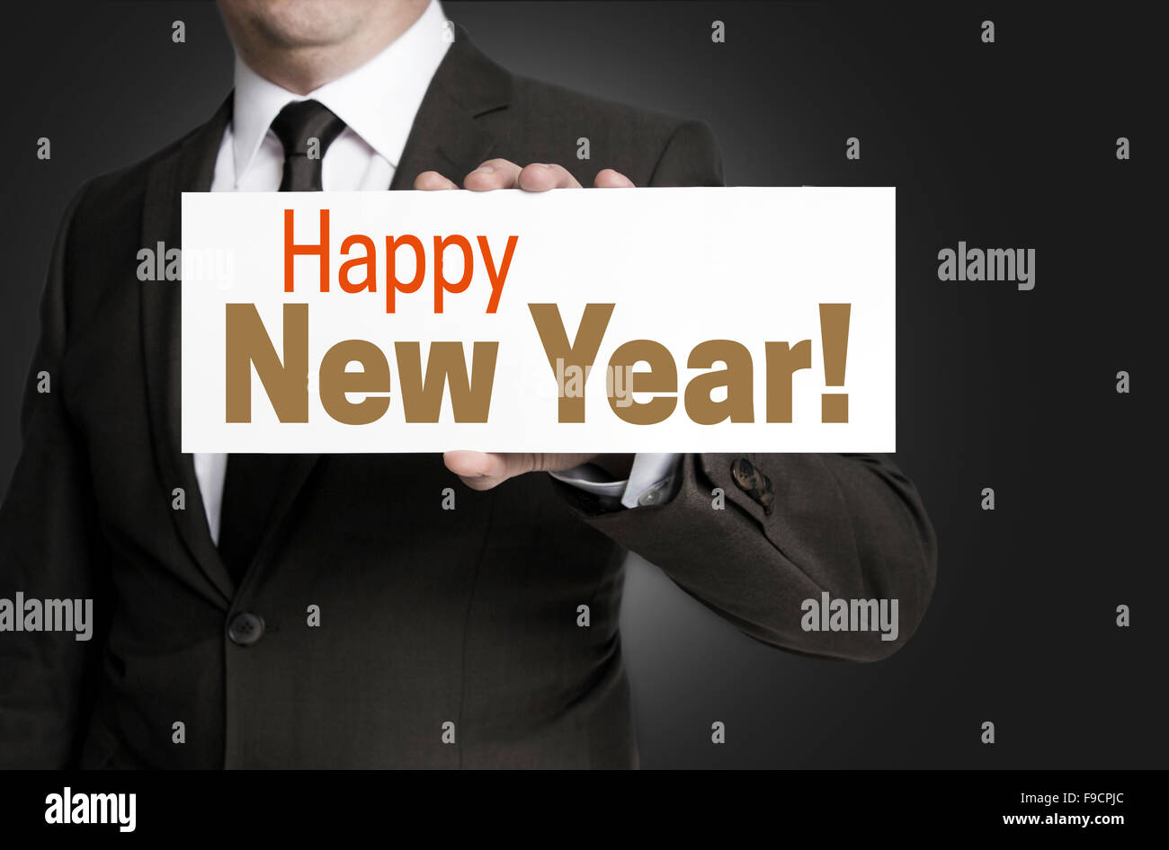 Happy New Year sign held by businessman concept Stock Photo - Alamy