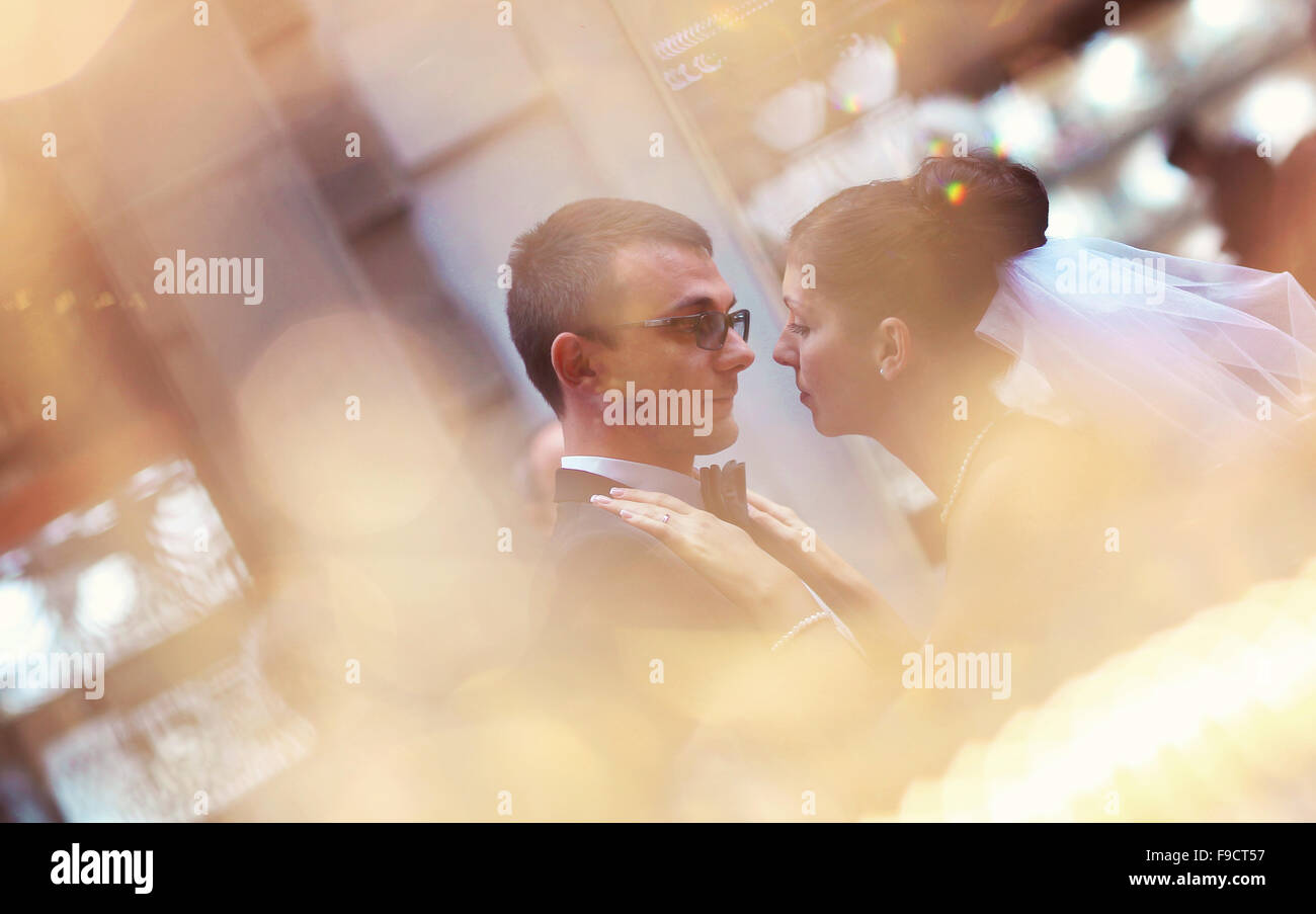 Bride and groom hugging in the city Stock Photo - Alamy