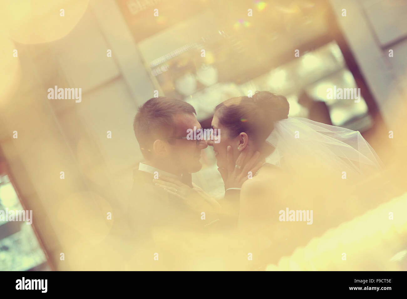 Bride and groom hugging in the city Stock Photo - Alamy