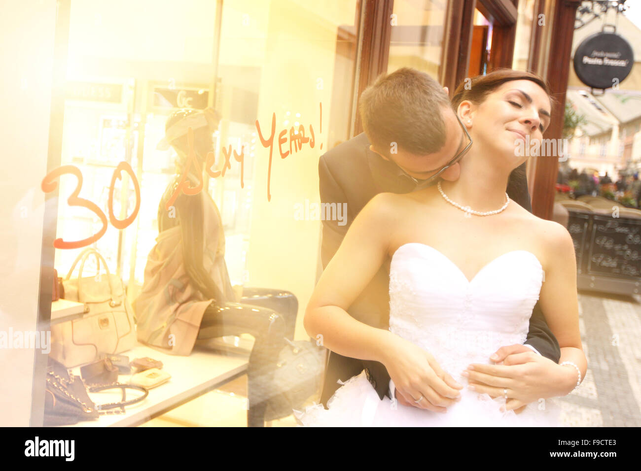 Bride and groom hugging in the city Stock Photo - Alamy