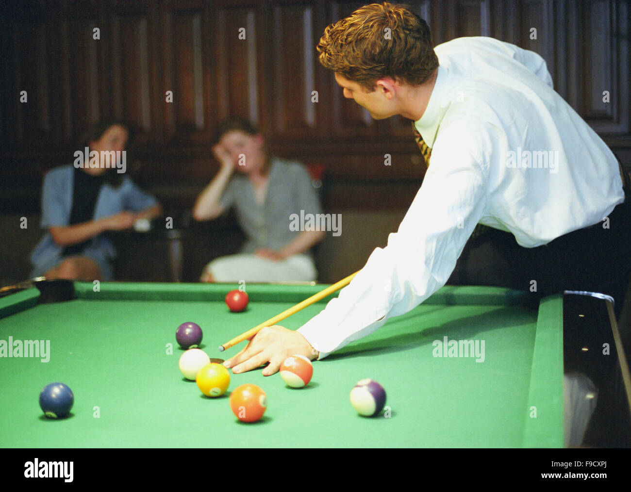 One Snooker Player And Two Viewers Stock Photo