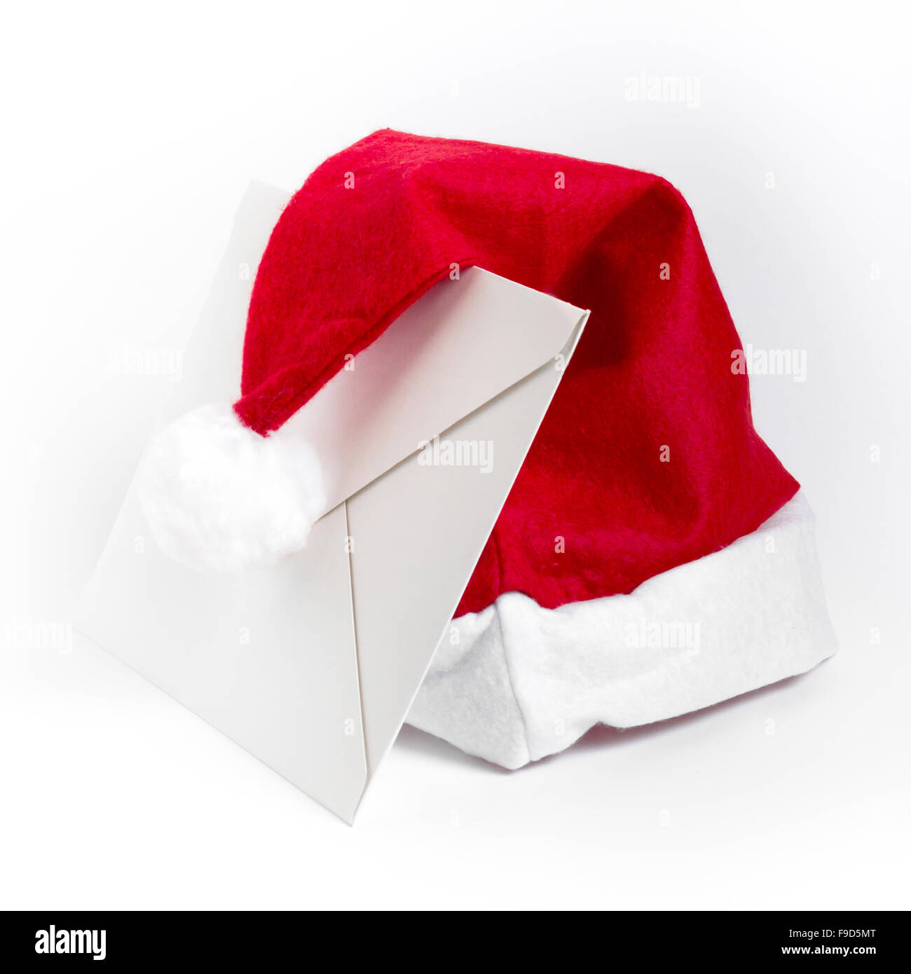 White letter and Santa Claus hat, isolated on white background Stock
