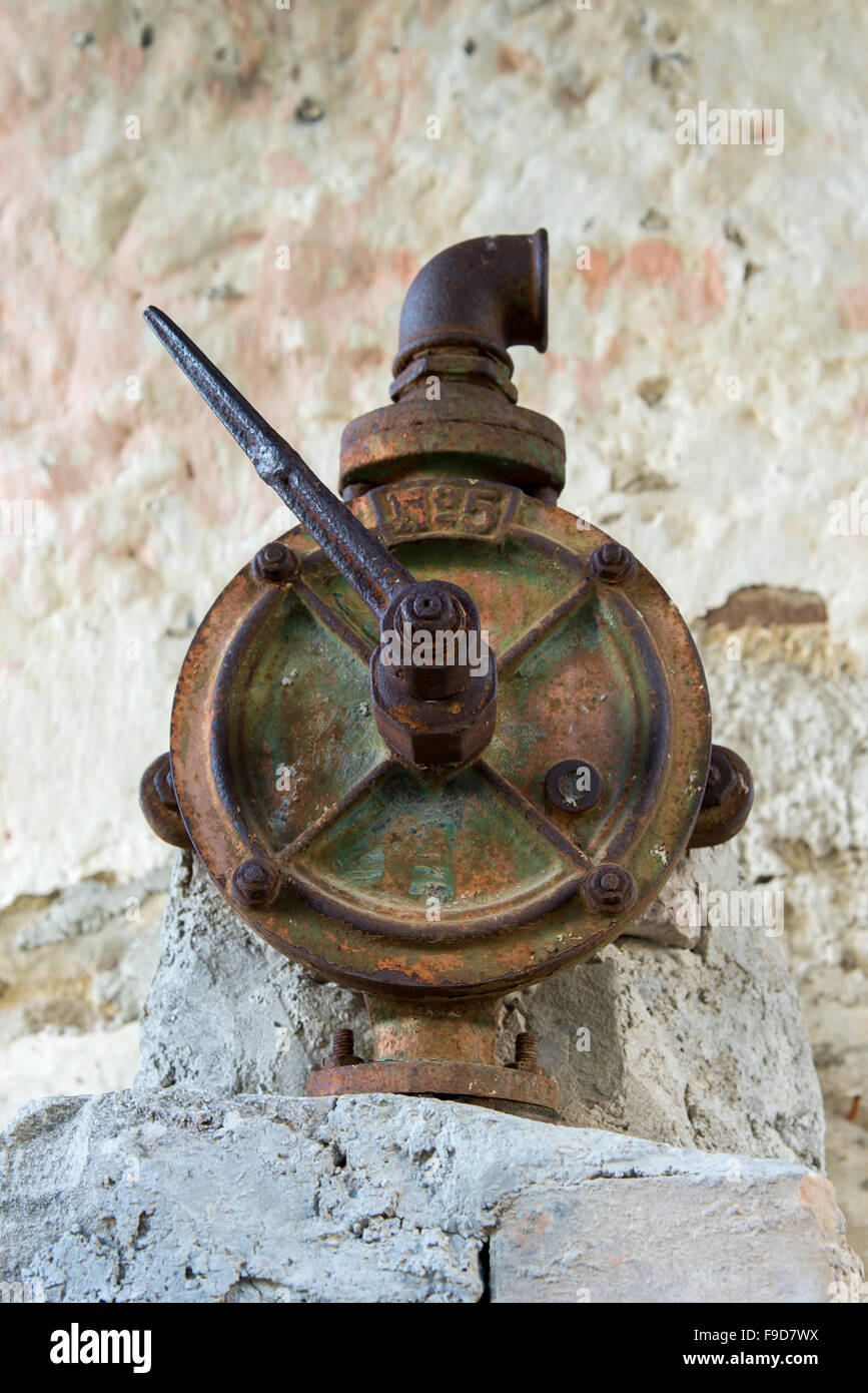 authentic old rusty faucet in a water column Stock Photo