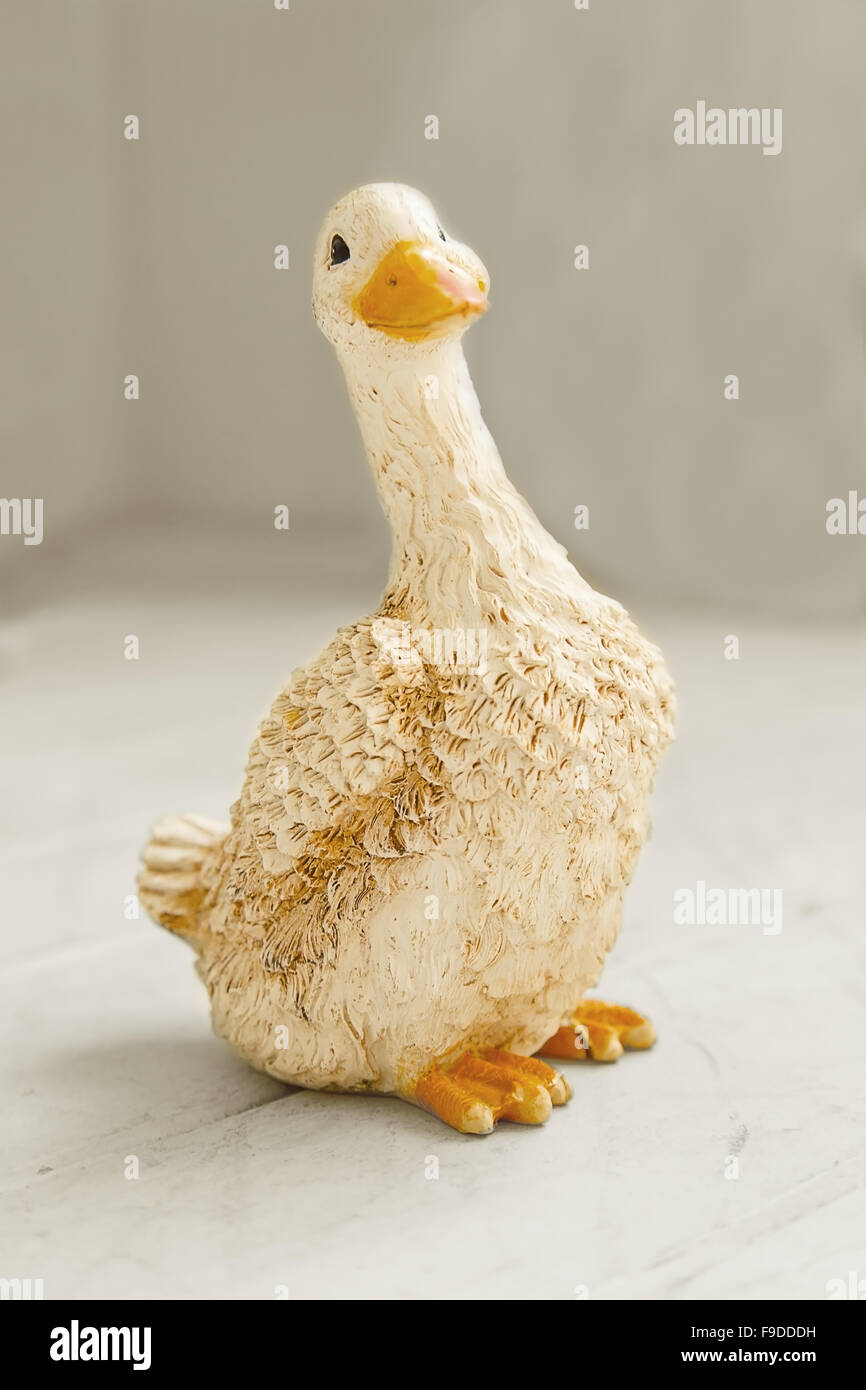 Ceramic goose figurine on light background Stock Photo Alamy
