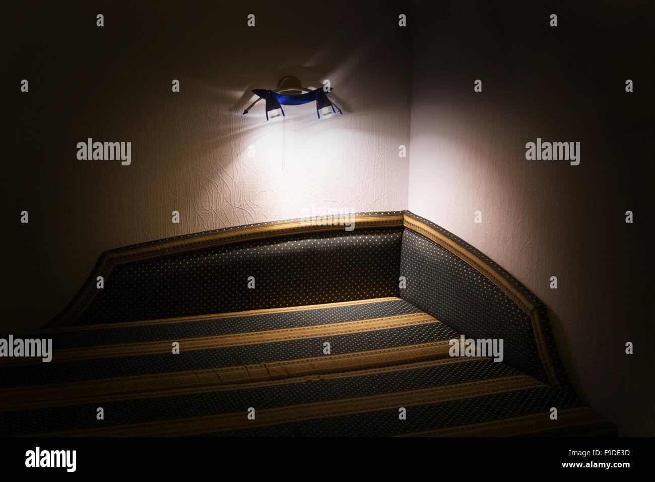 Night scene in hotel room, nightstand with lamp Stock Photo - Alamy
