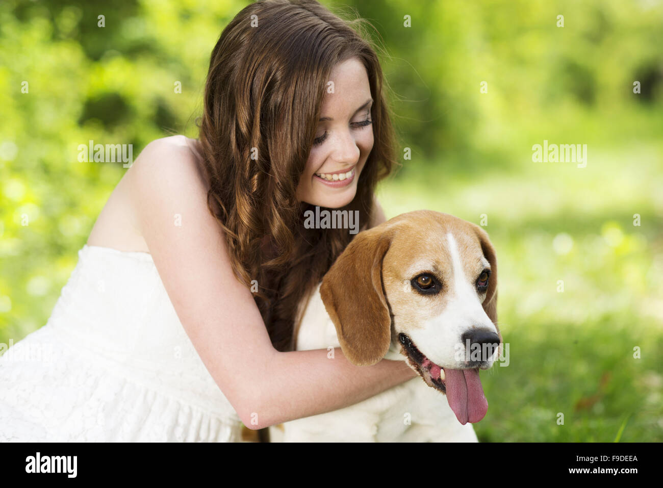 Portrait of a woman with her beautiful dog outdoors Stock Photo - Alamy