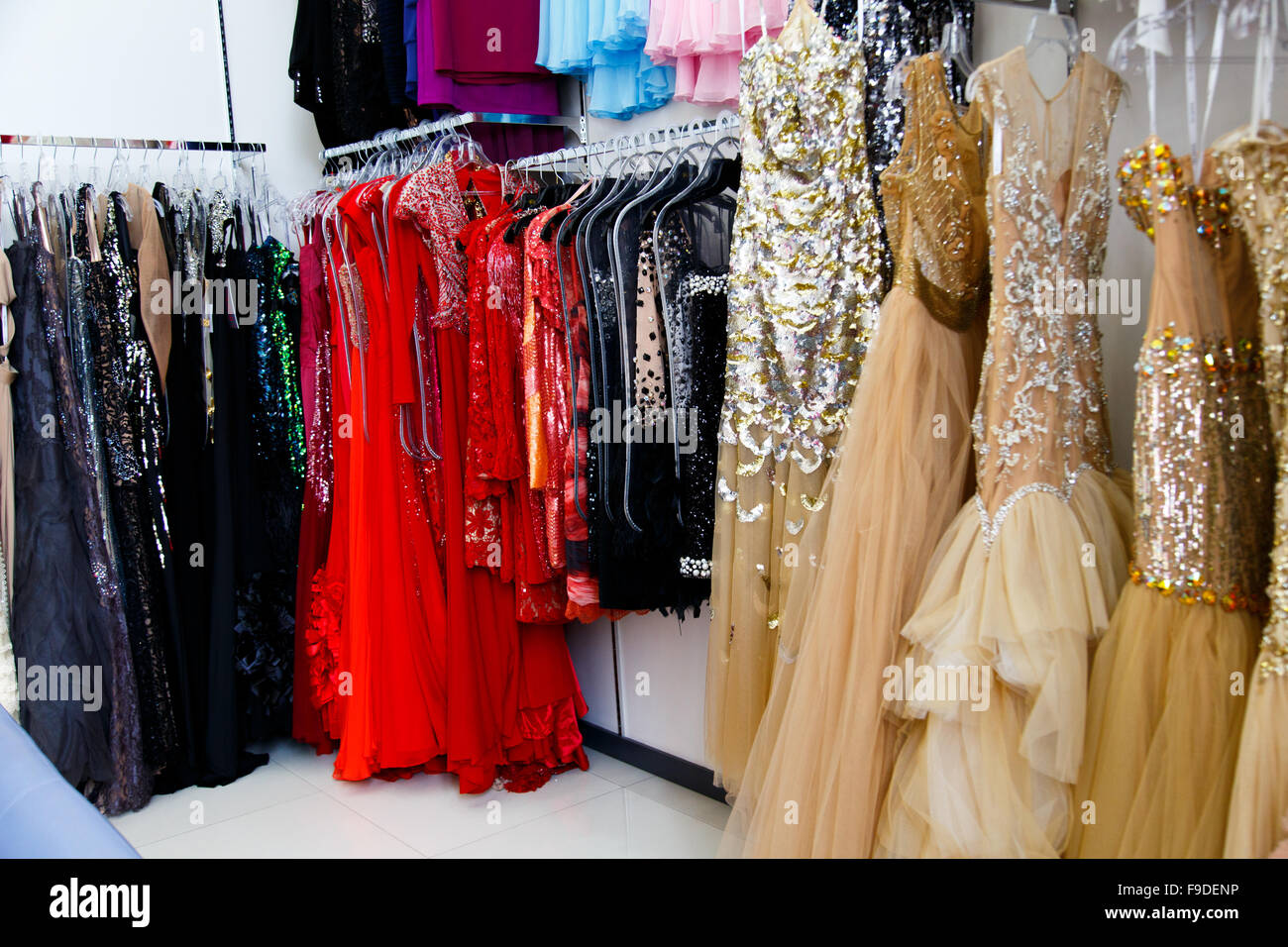 Evening dresses on hangers in store Stock Photo - Alamy