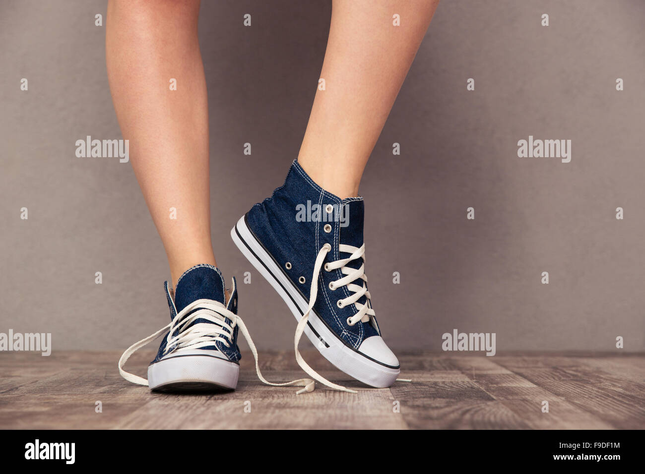 Closeup portrait of a human legs in sneakers Stock Photo - Alamy