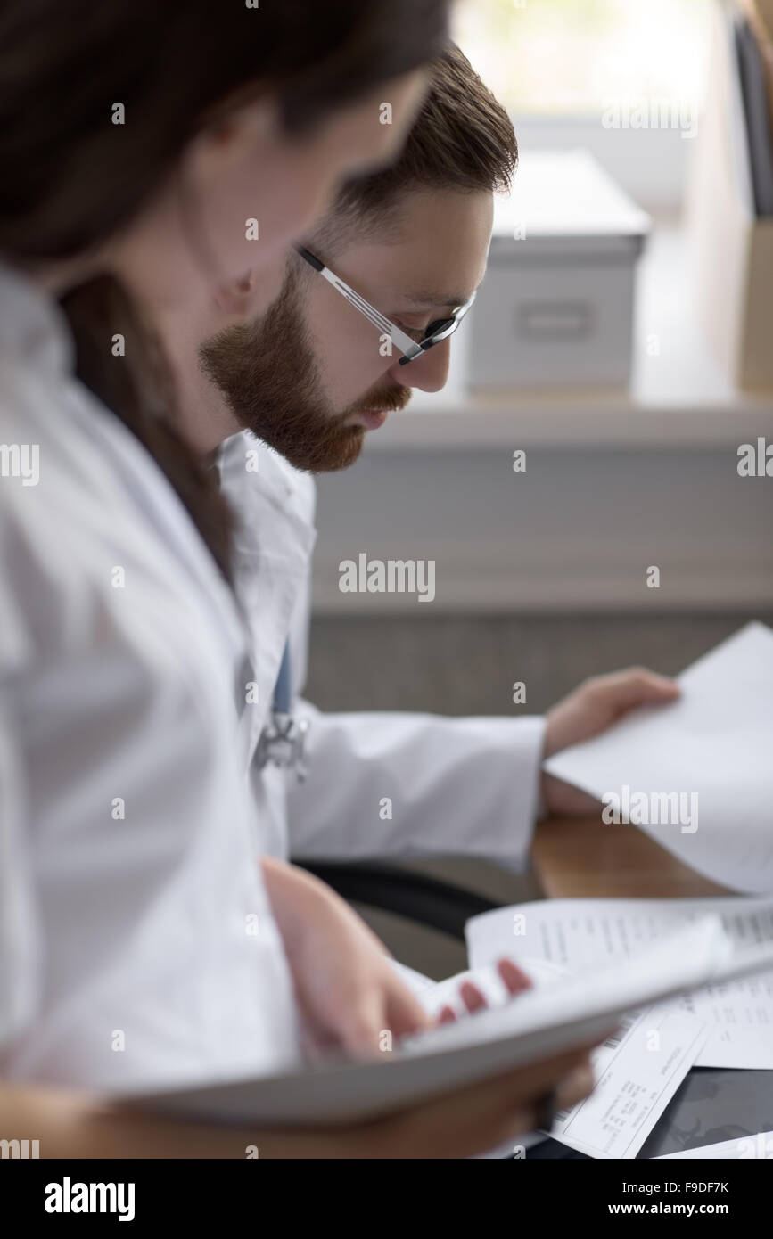 Two doctors discussing test results Stock Photo