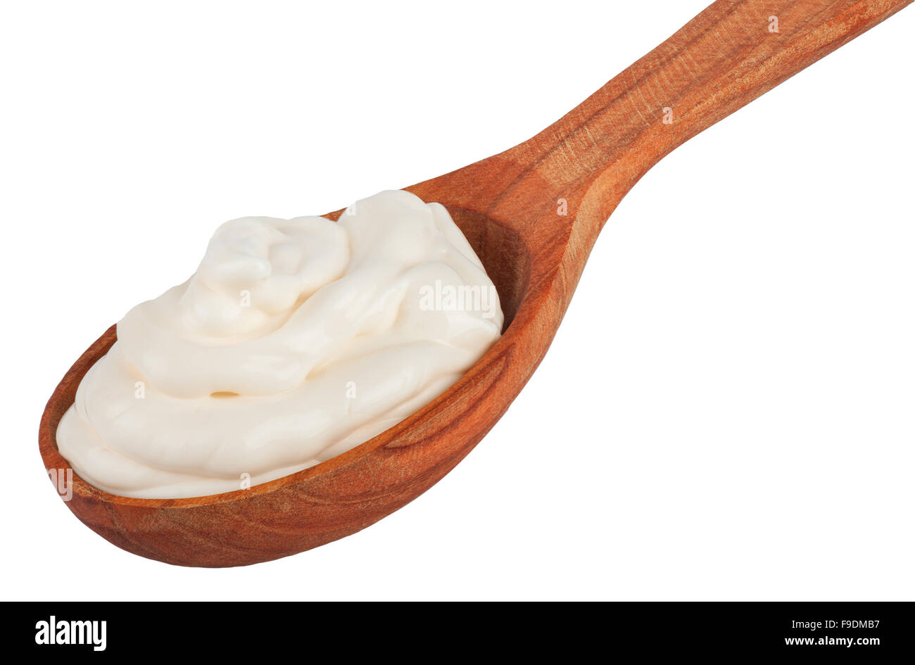 Handful of mayonnaise in wooden spoon isolated on a white background Stock Photo