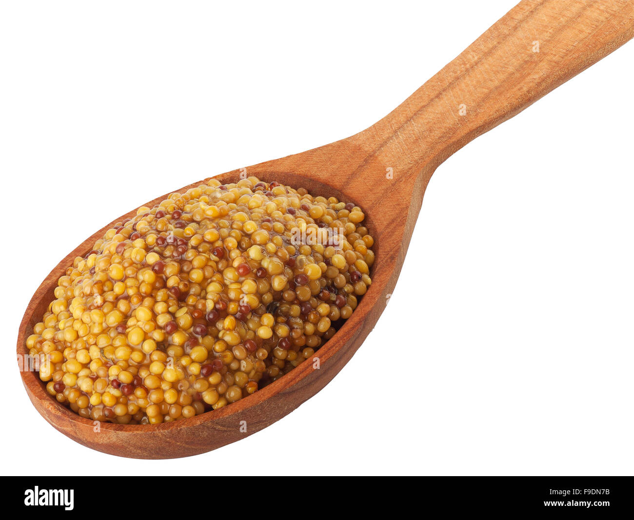 Wholegrain mustard in wooden spoon isolated on white background Stock Photo