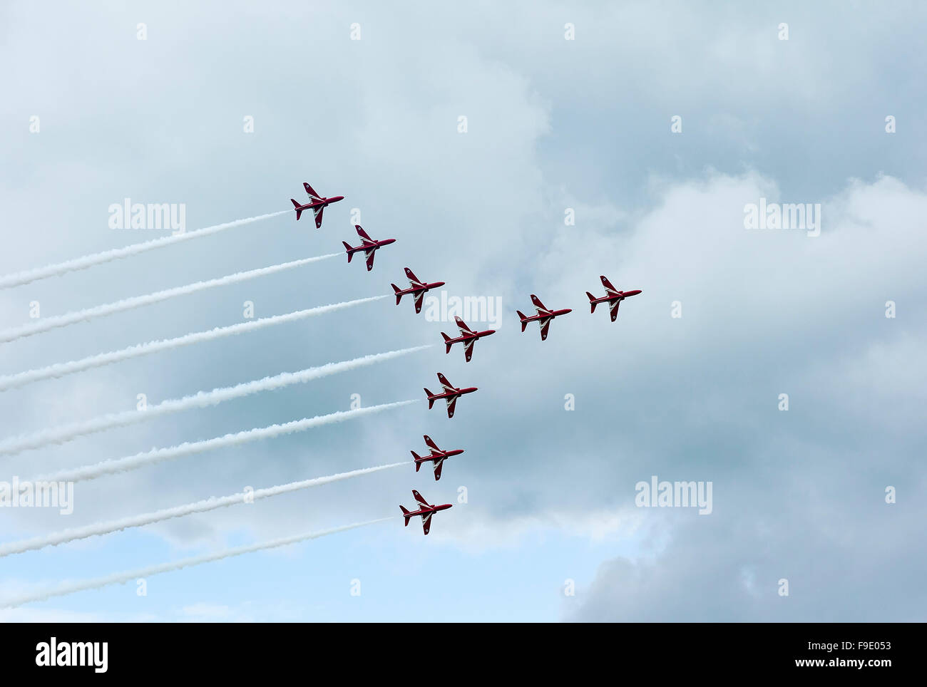 British Red Arrows Hawk aircraft flying the SWAN formation at an English air display Stock Photo