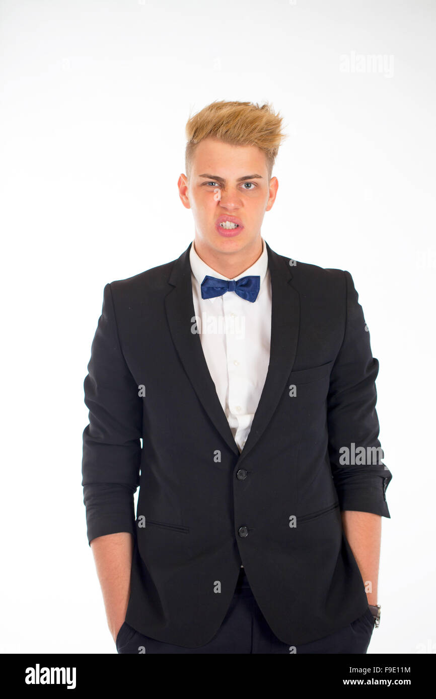 Close-up portrait of a handsome young man in a business suit on white ...