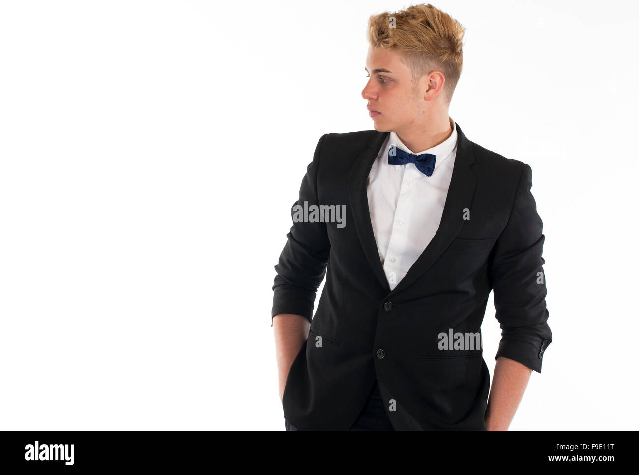 Close-up portrait of a handsome young man in a business suit on white ...