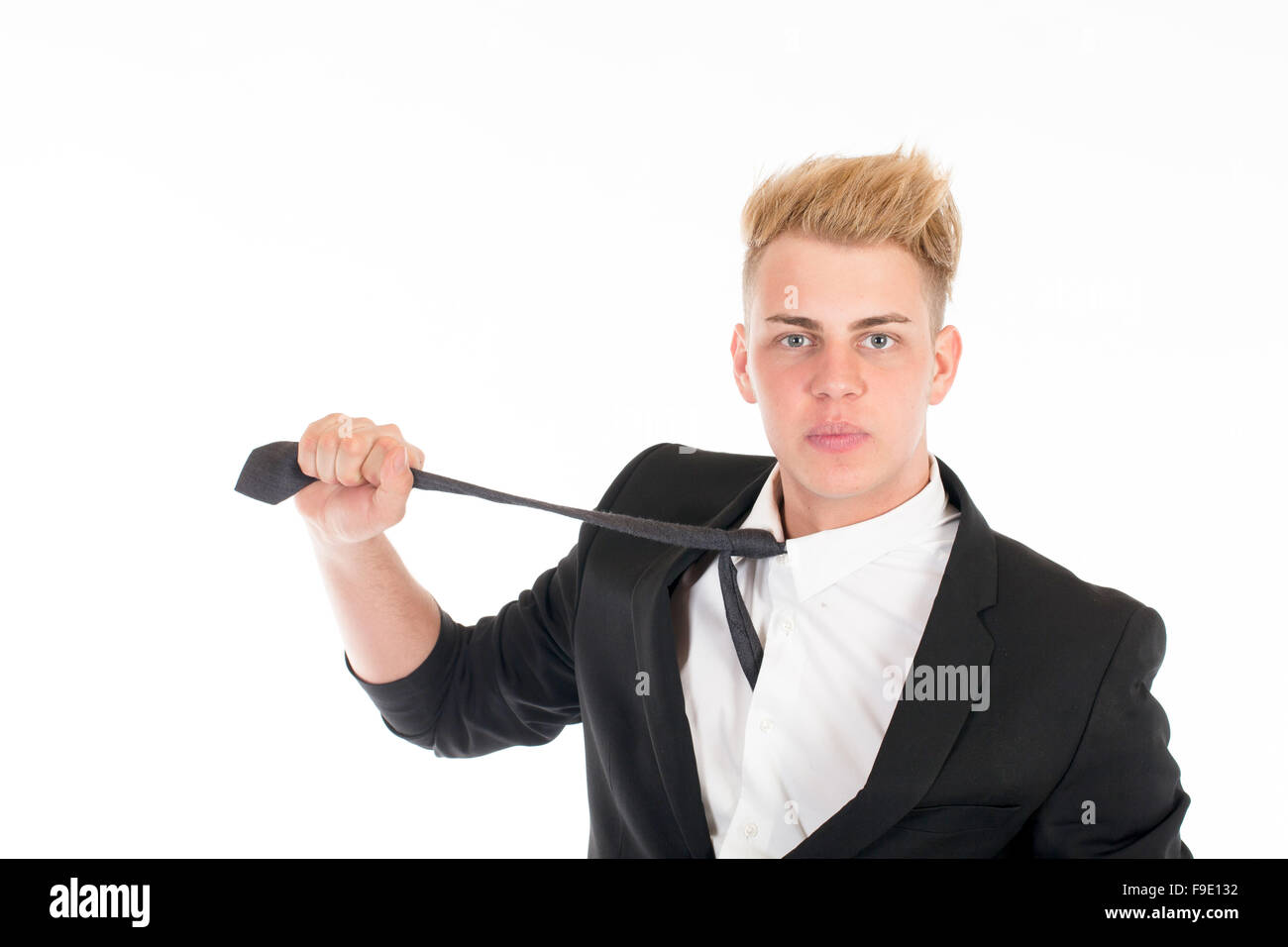 Close-up portrait of a handsome young man in a business suit on white ...