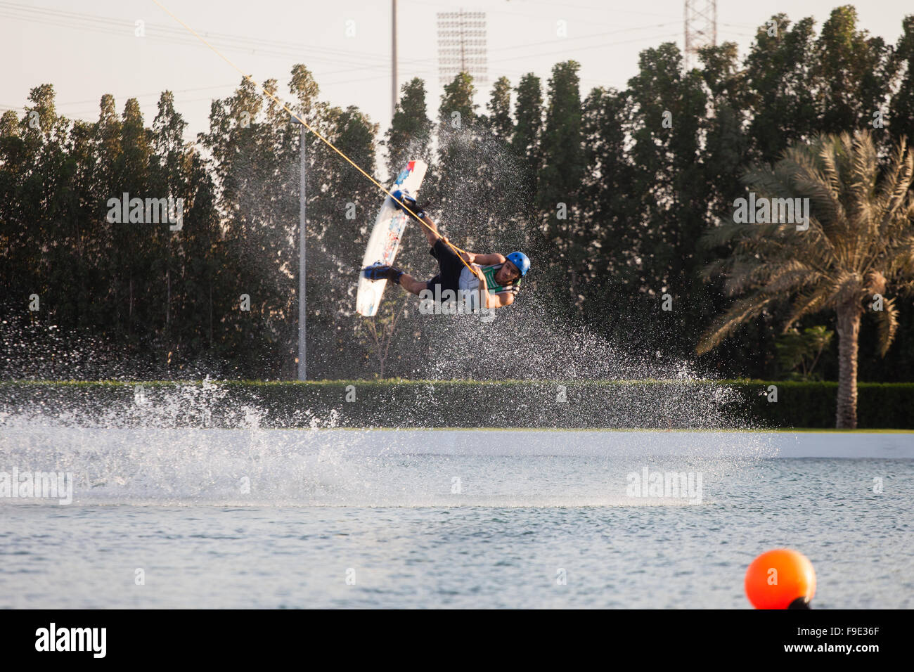 A wakeboarder jumping at Al Forsan wakeboard park in Abu Dhabi Stock