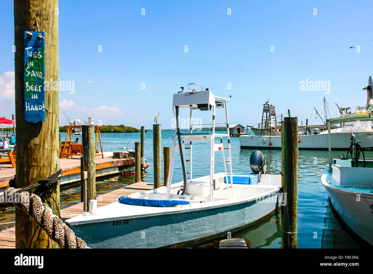 Boats, both private and commercial moored at Cortez docks in Florida Stock Photo