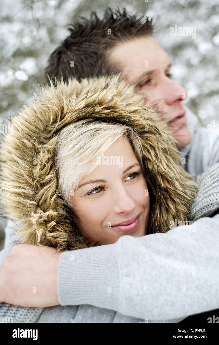 Happy couple is having romantic time in snowy countryside Stock Photo ...