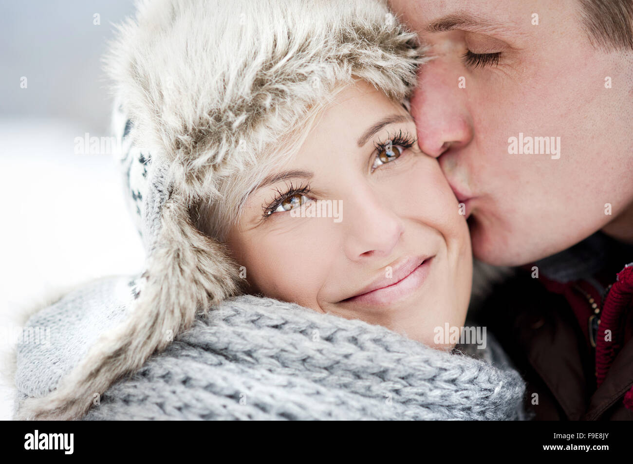 Happy couple is having romantic time in snowy countryside Stock Photo ...