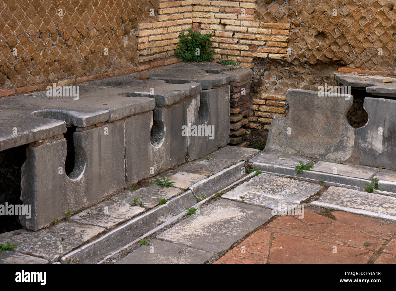 Latrine at the Domus of Triclini in the ancient Roman port of Ostia, near Rome, Italy, Europe Stock Photo