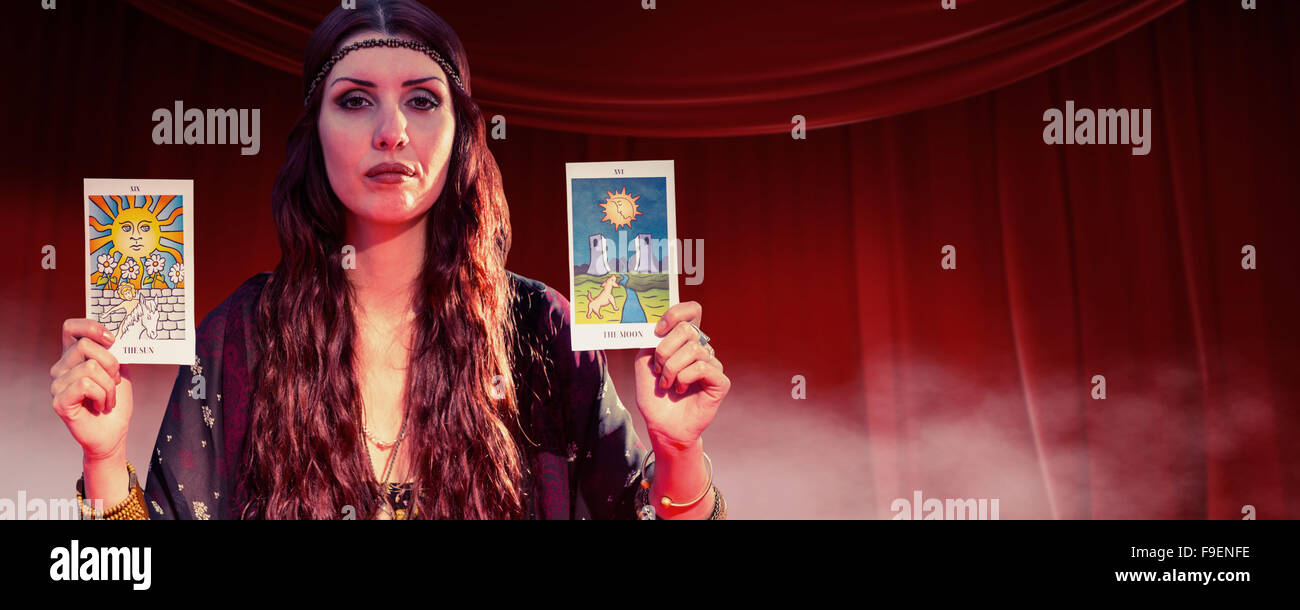 Composite image of portrait of fortune teller woman showing tarot cards Stock Photo Alamy