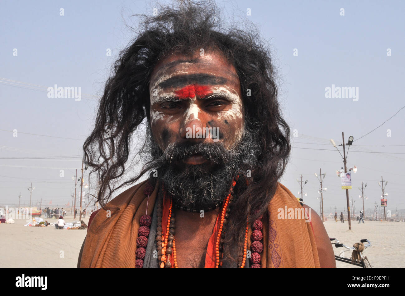 An Aghori Baba, long hairs, ash -tilak on face wearing rudraksha bead at Mahakumbh mela, Prayag, Allahabad, Uttar Pradesh, India Stock Photo