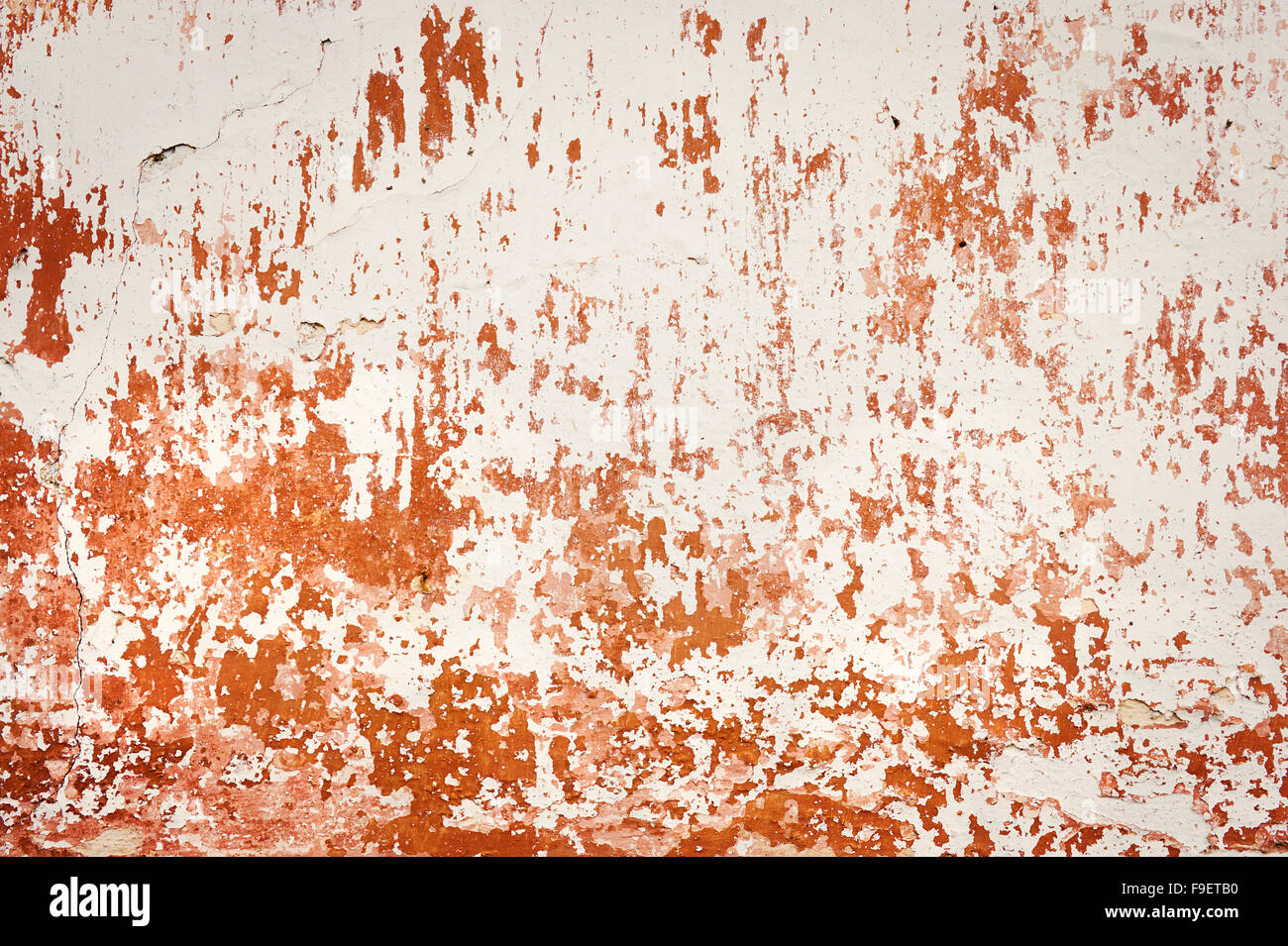 Old empty wall background, plaster falling off. Stock Photo