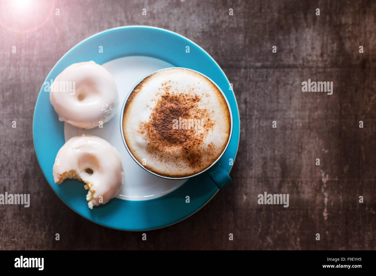 Coffee and doughnuts on a wooden table background Stock Photo - Alamy