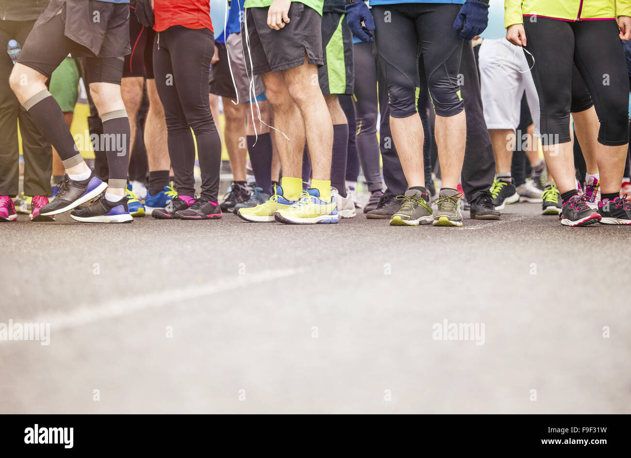 Detail of the legs of runners at the start of a marathon race Stock Photo