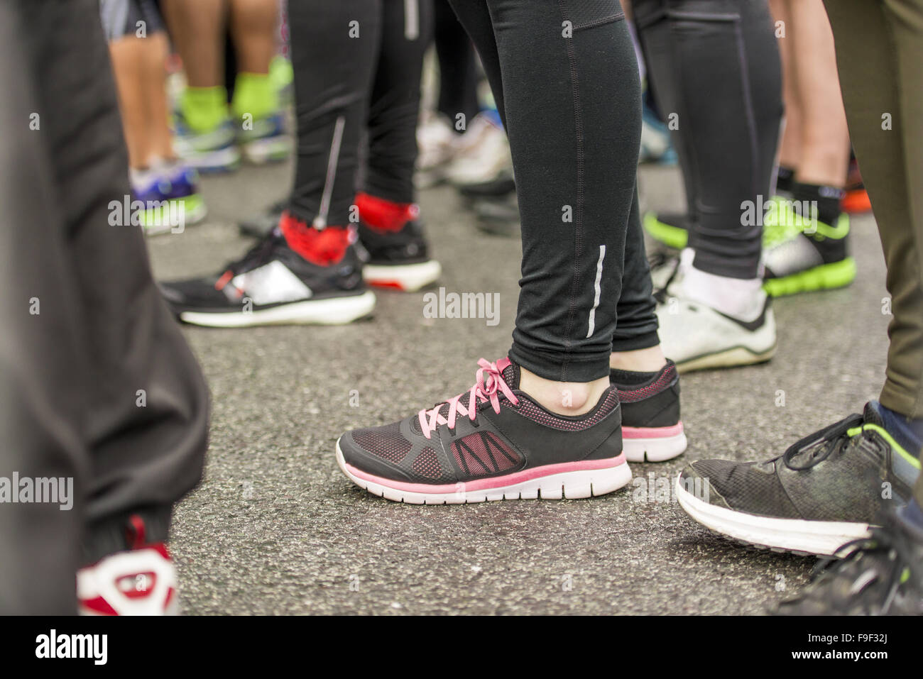 Detail of the legs of runners at the start of a marathon race Stock Photo
