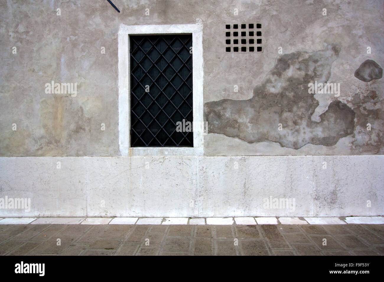 Window on a grey stone wall Stock Photo - Alamy