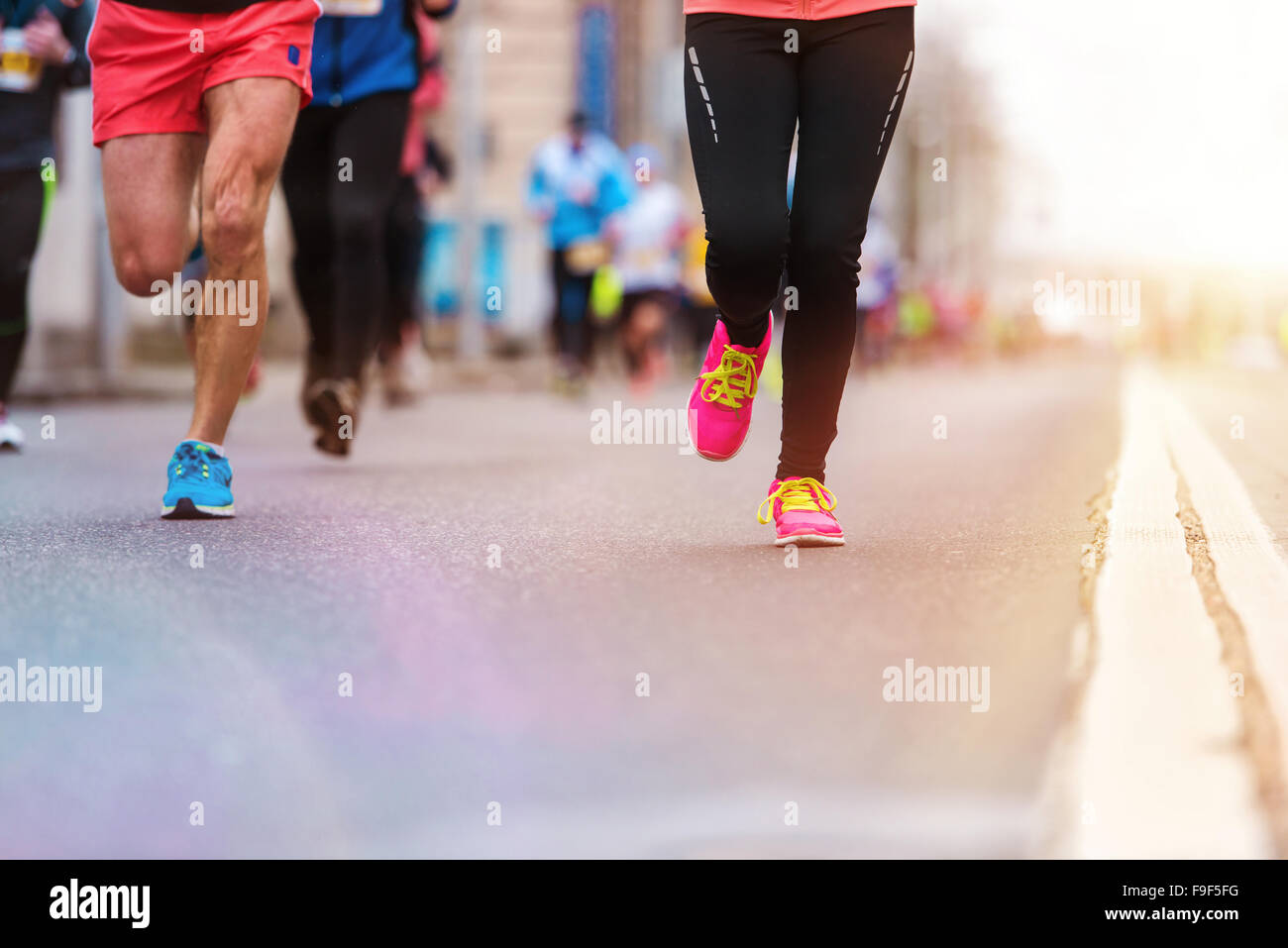 Legs of unrecognizable young woman running in a competition Stock Photo