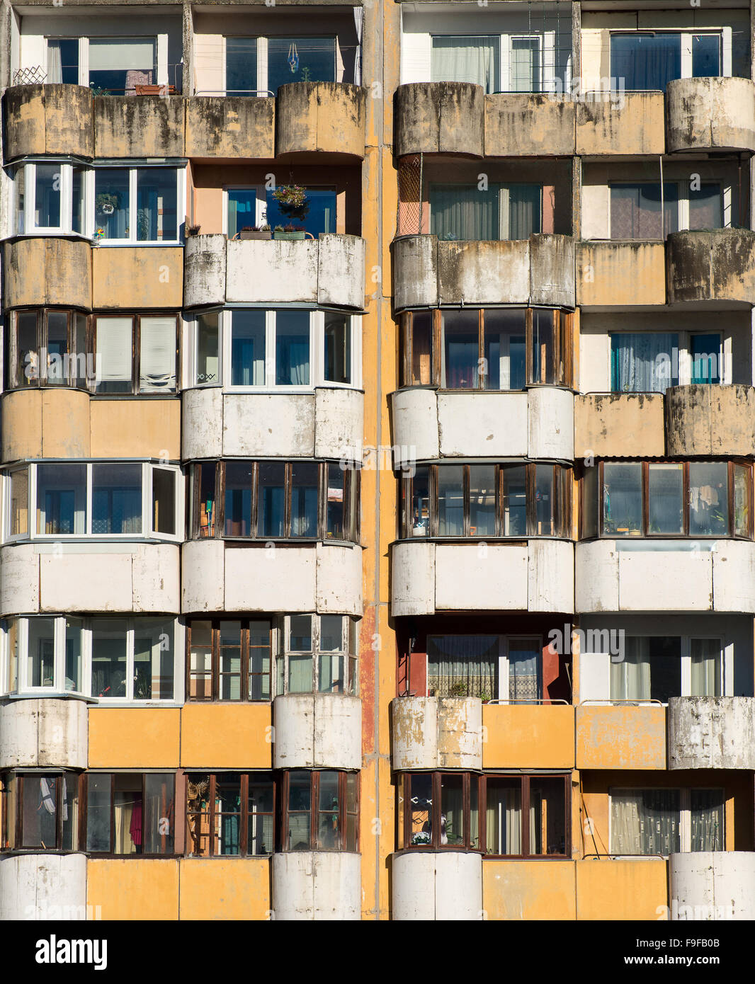 Dirty facade with balconies and windows Stock Photo - Alamy