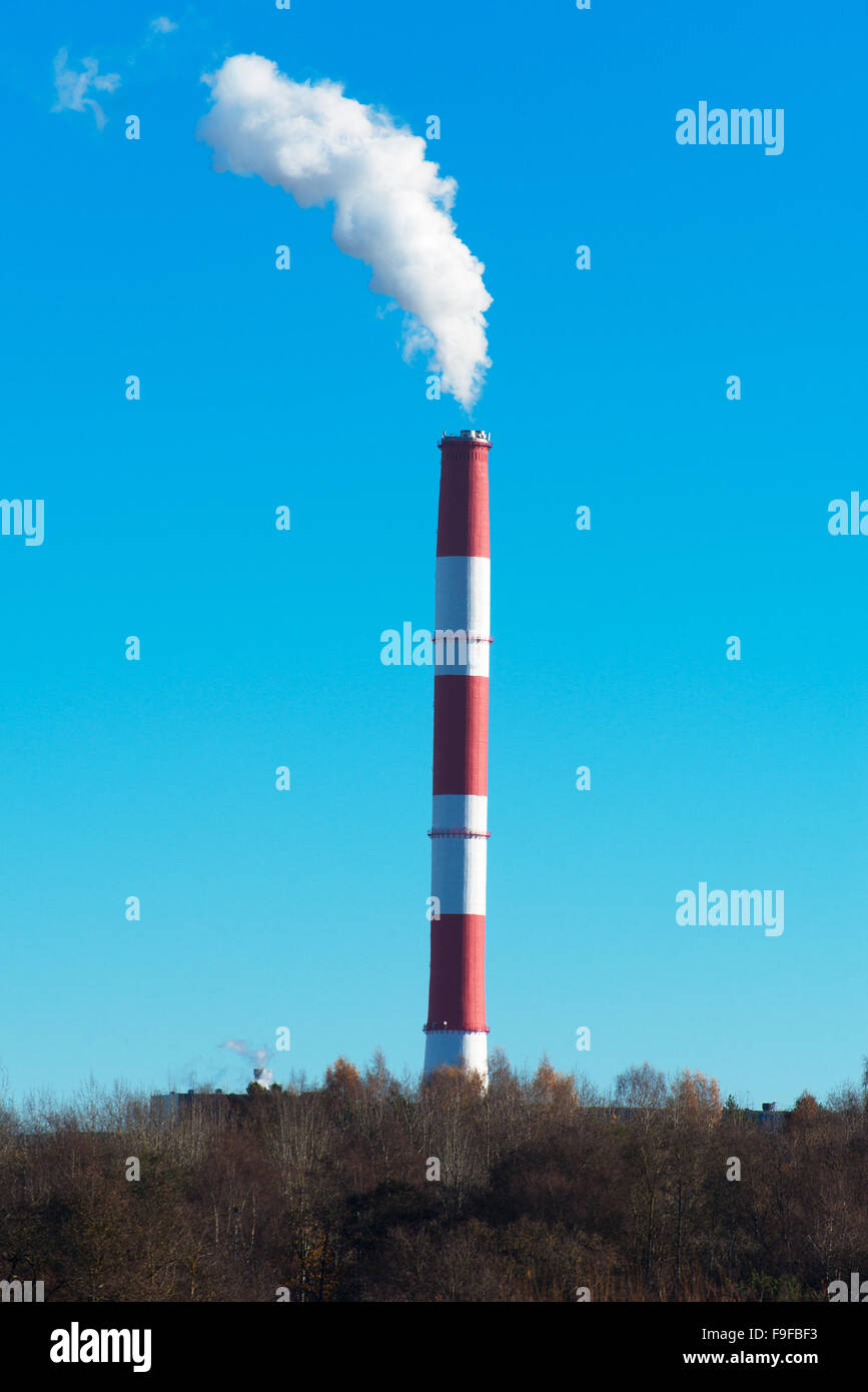 Air pollution. Dirty smog from big factory chimney. Stock Photo