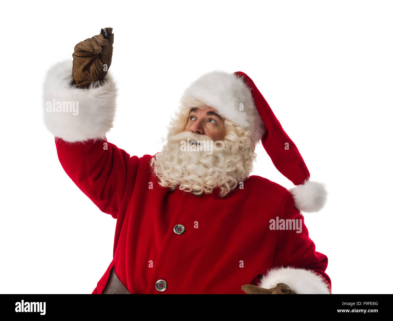 Santa Claus drawing in the air. Portrait Isolated on White Background Stock Photo