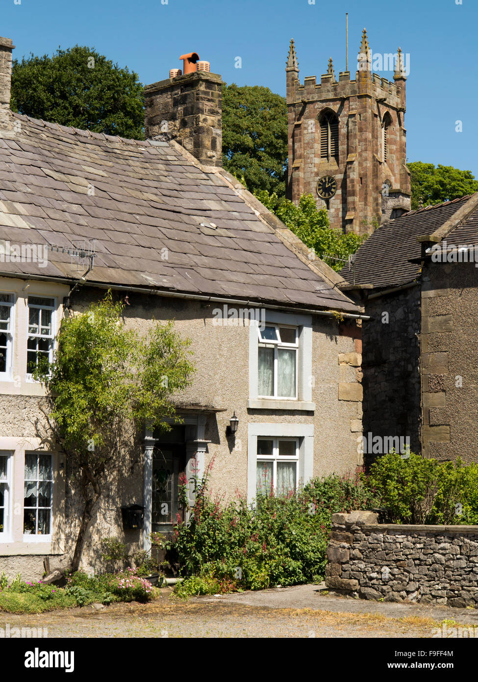 UK, England, Derbyshire, Hartington, Village houses below tower of St