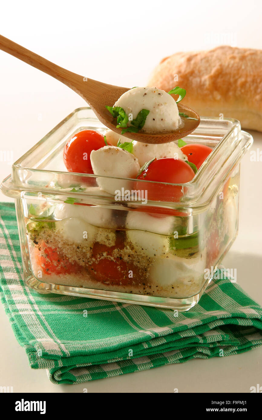 Pickled mozzarella with tomatoes hires stock photography and images