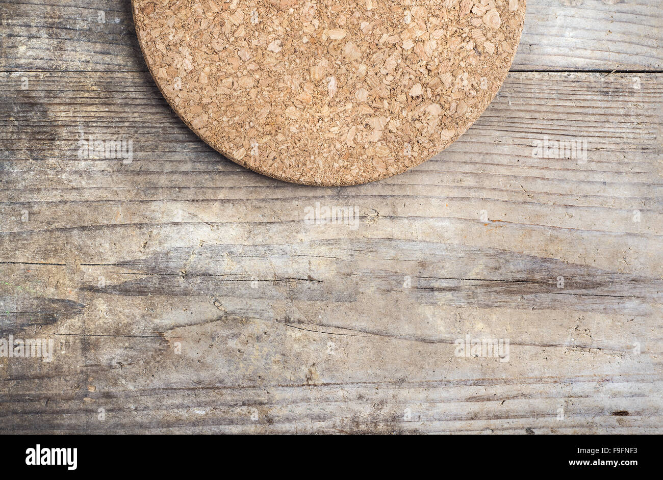 Round cork mat on wooden floor background Stock Photo Alamy