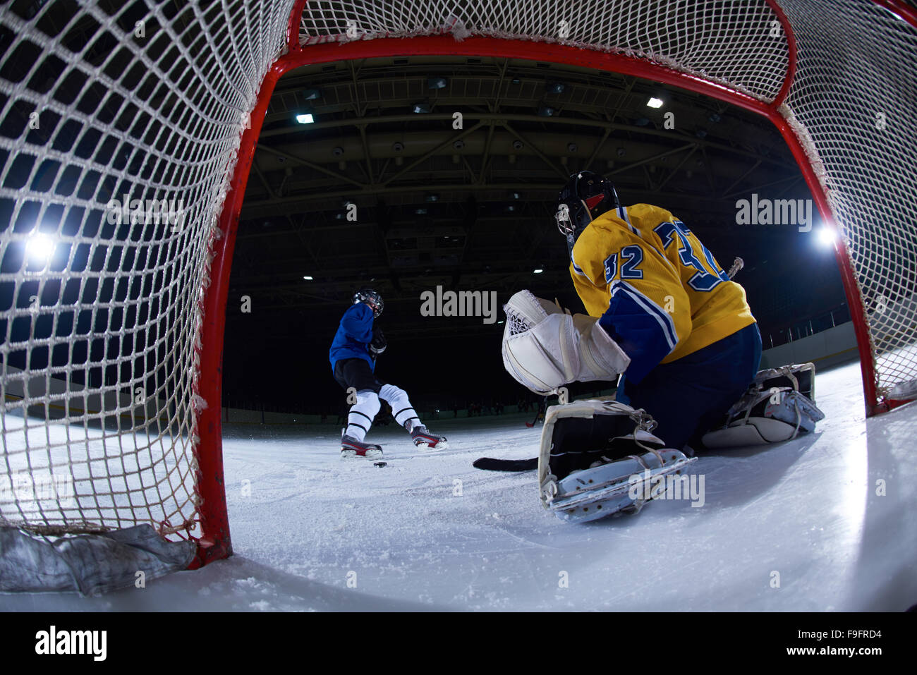 ice hockey goalkeeper player on goal in action Stock Photo Alamy