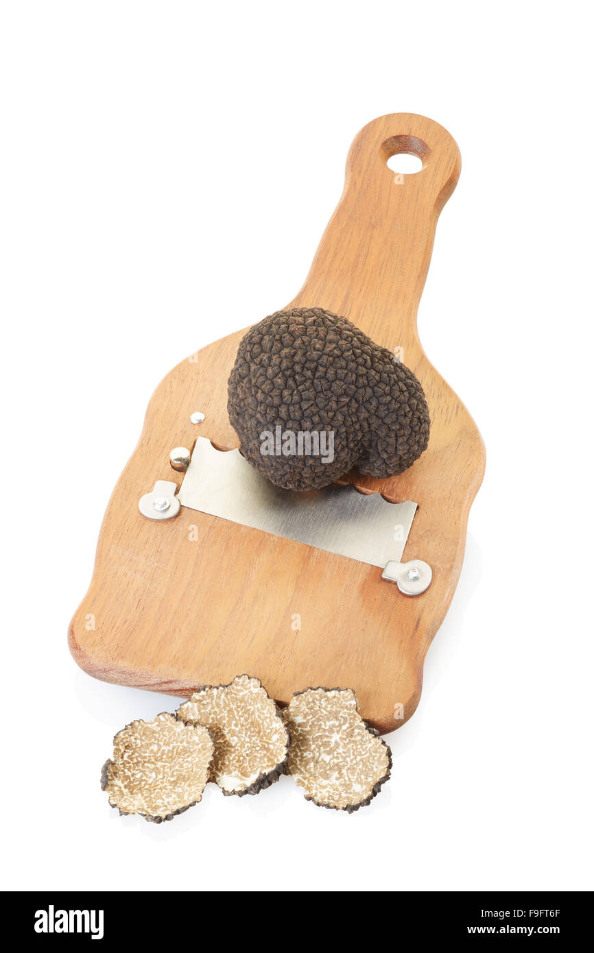 Black truffle, slices and wooden truffle slicer Stock Photo