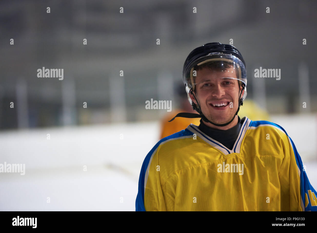 young ice hockey player portrait on training in black background Stock