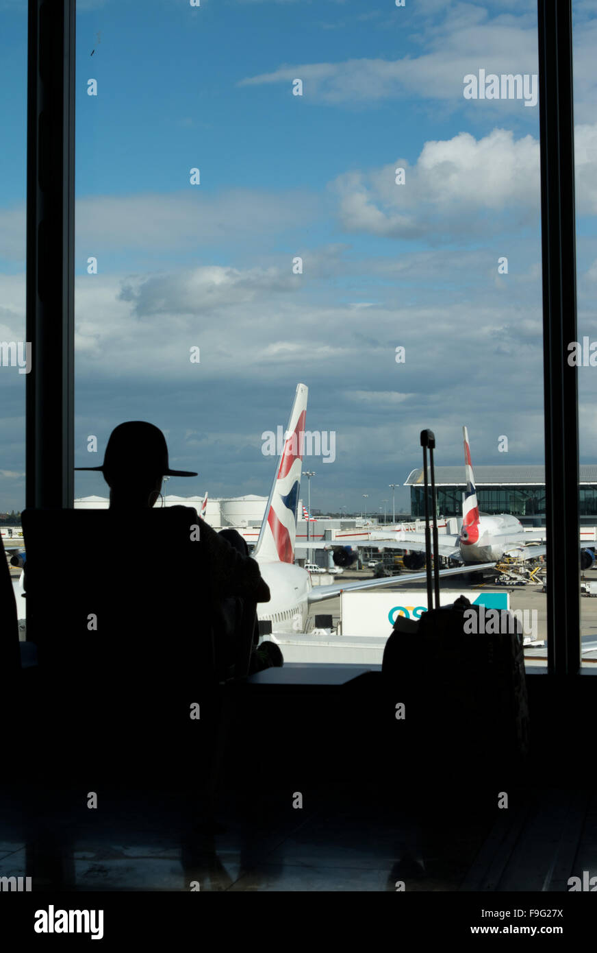 Silhouette of a female passenger sitting by the window. Stock Photo