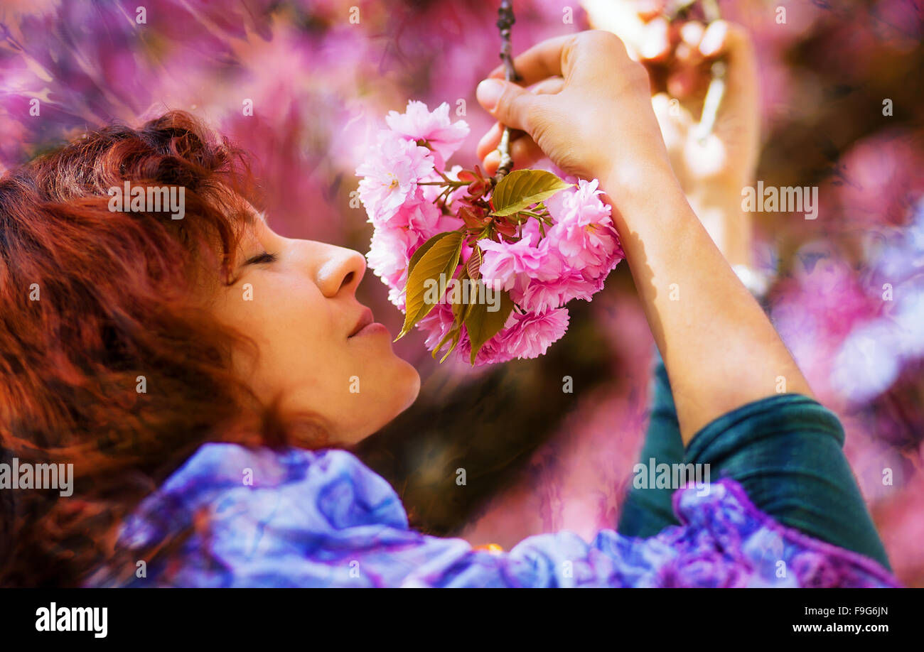 Beautiful Girl with flowers, Spring Magic. Sakura pink flowers Stock ...